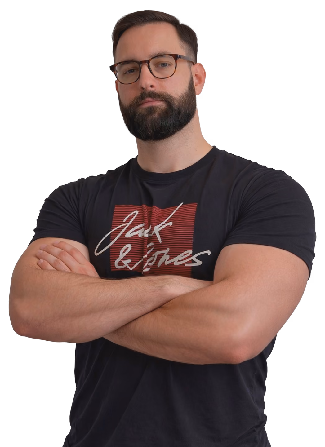 Man with beard and glasses wearing a black Jack & Jones t-shirt with arms crossed.